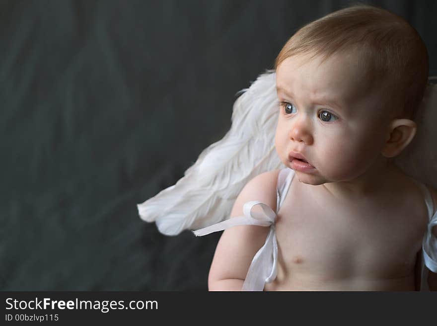 Image of baby wearing angel wings. Image of baby wearing angel wings