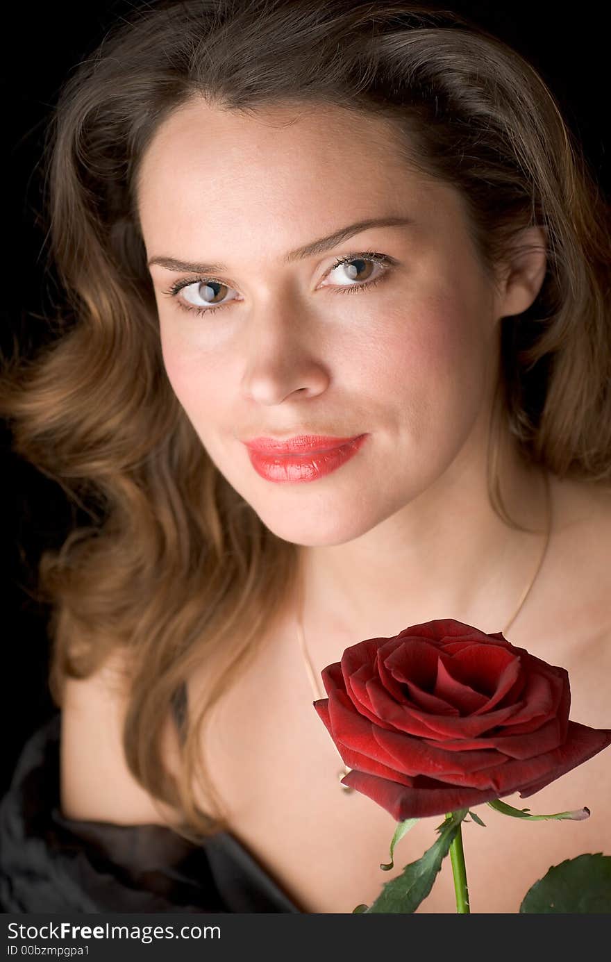 Beautiful lady with red rose. Portrait