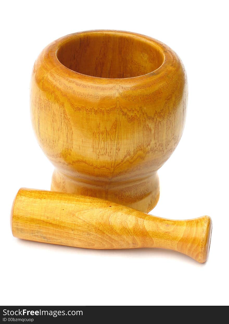 Wooden mortar with pestle lying near it on white background. Wooden mortar with pestle lying near it on white background