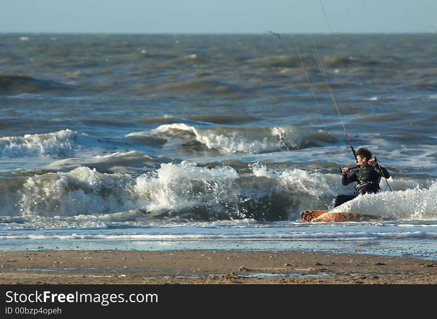 Kite surfer in action close to the beach