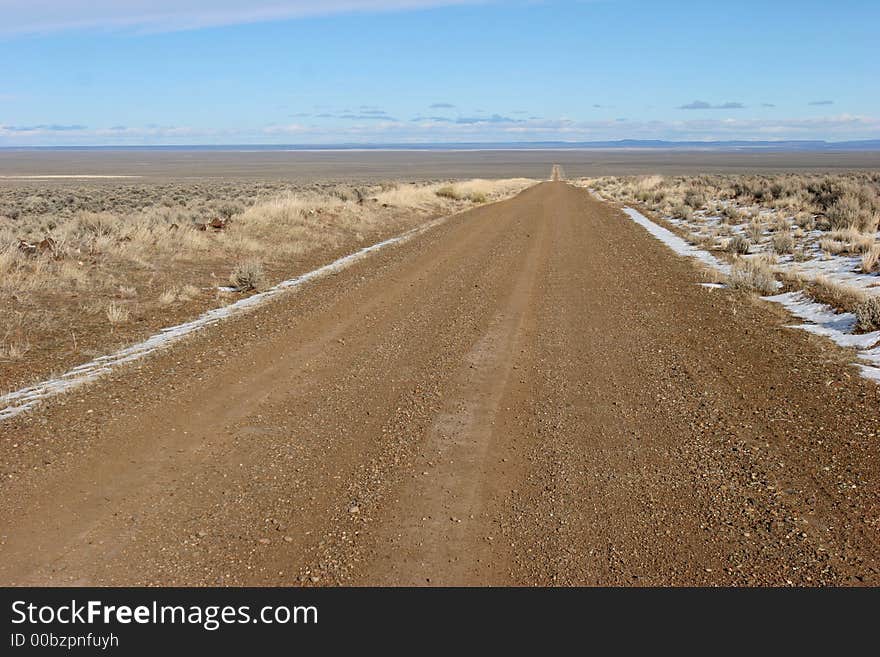 Gravel desert road; clean, crisp, sharp image.