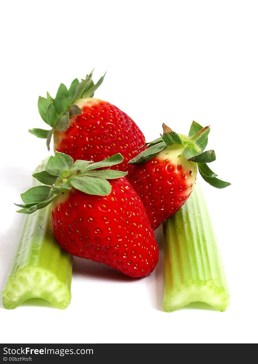 Fresh green cerely stem with red strawberry. Fresh green cerely stem with red strawberry