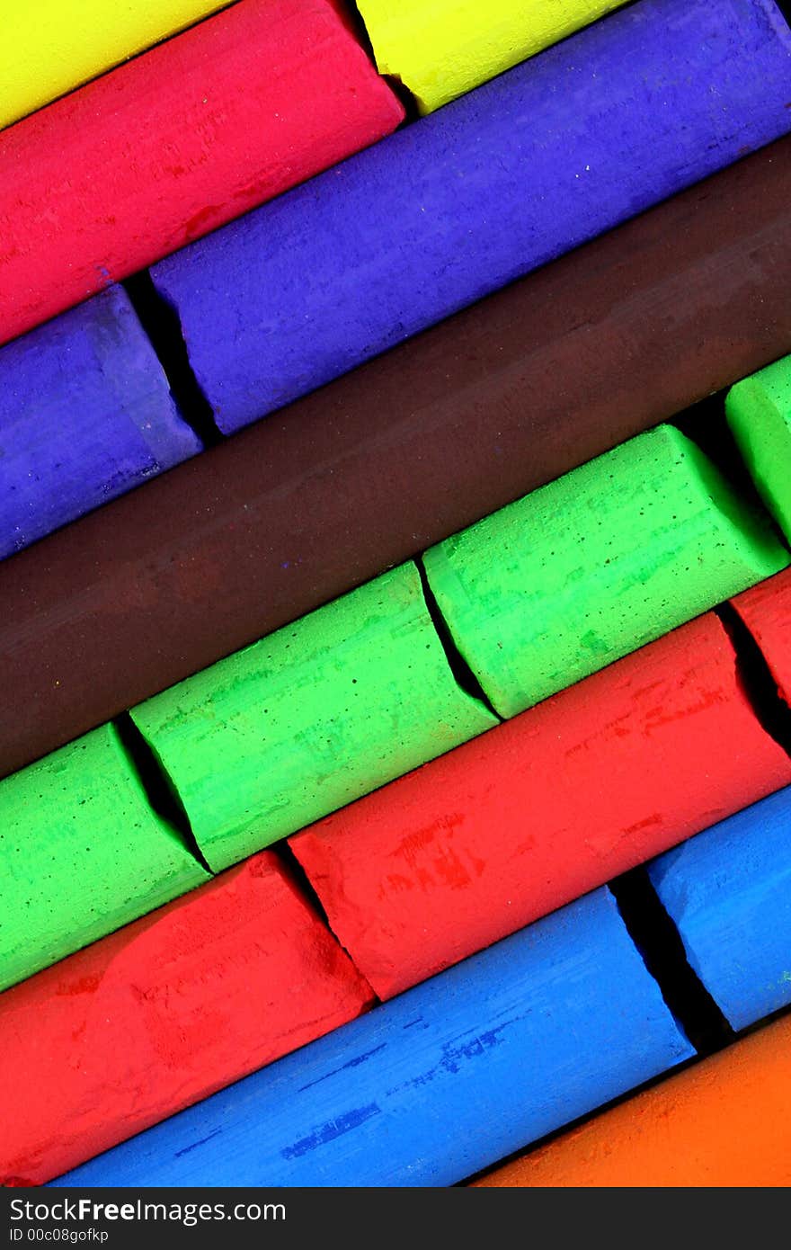 Colorful chalks (red, green, brown, blue, orange)