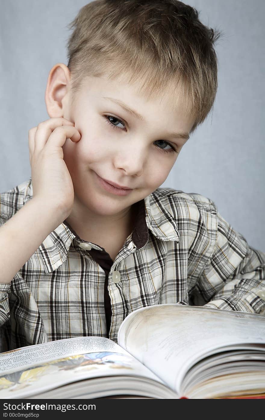 Little smiling boy with big book. Little smiling boy with big book