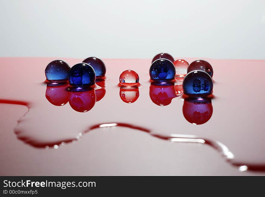 The glass balls reflected in water