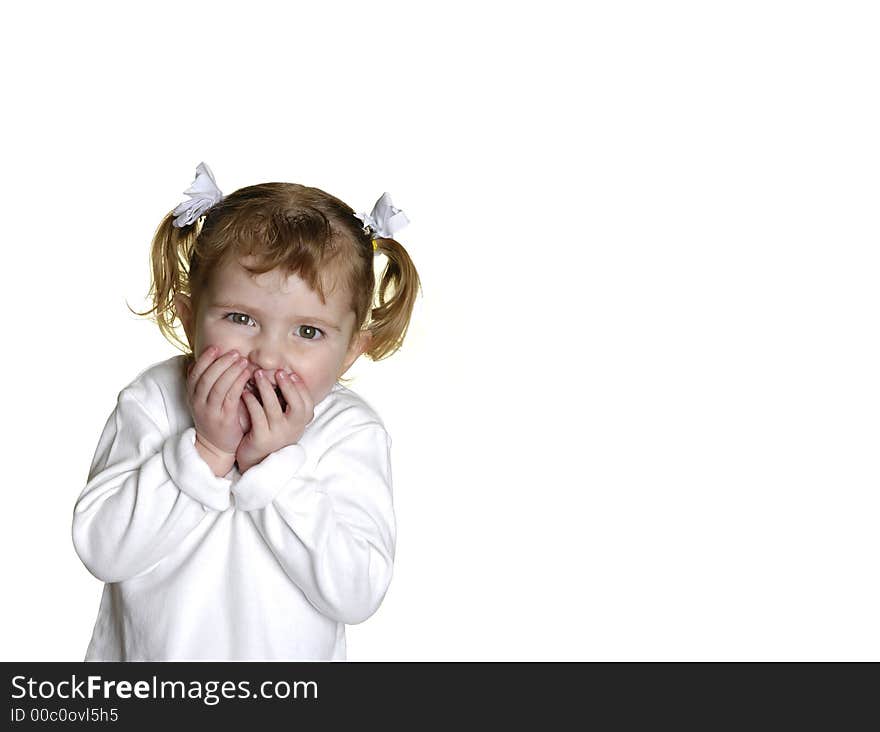 Little girl dressed in white making faces expressions. Little girl dressed in white making faces expressions