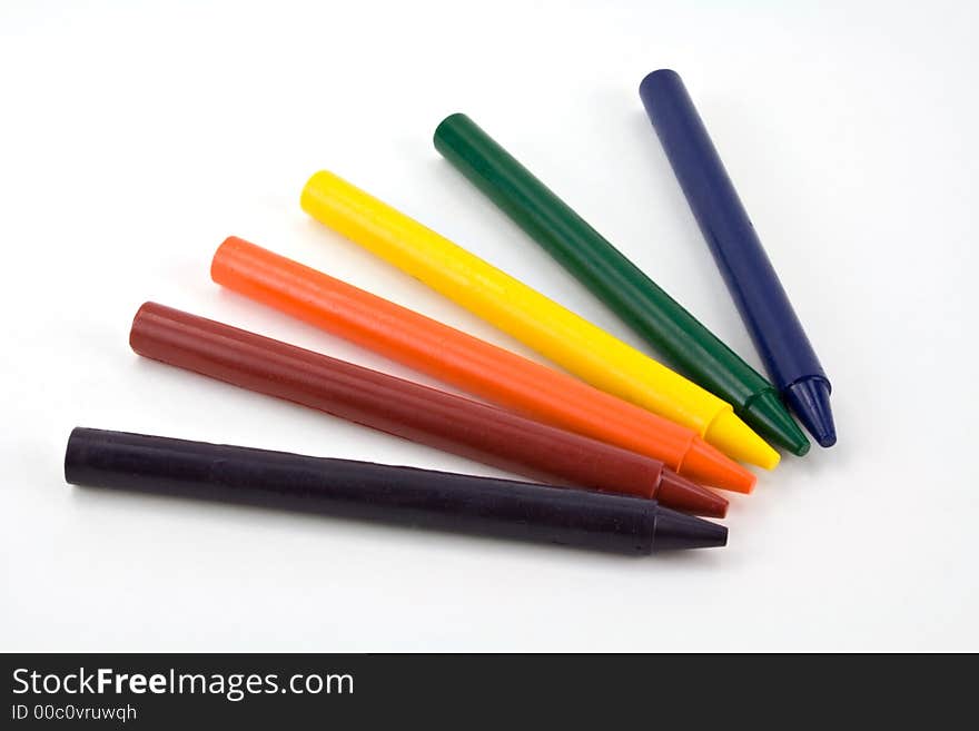 Six colorful crayons on a white background. Six colorful crayons on a white background