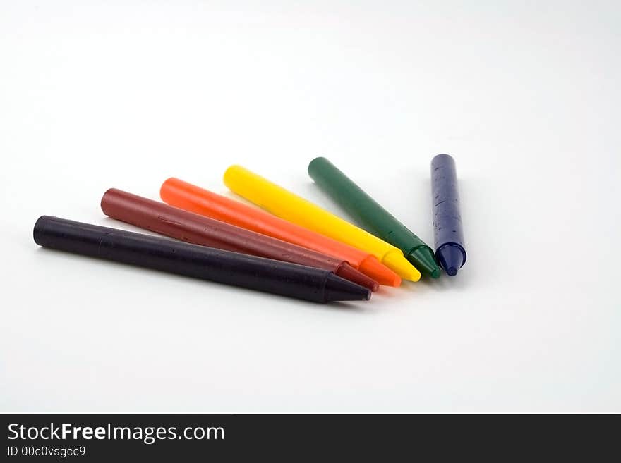 Six colorful crayons on a white background. Six colorful crayons on a white background