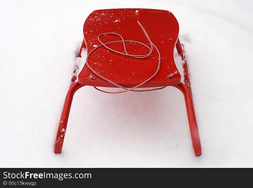 Red sledge in the fresh snow