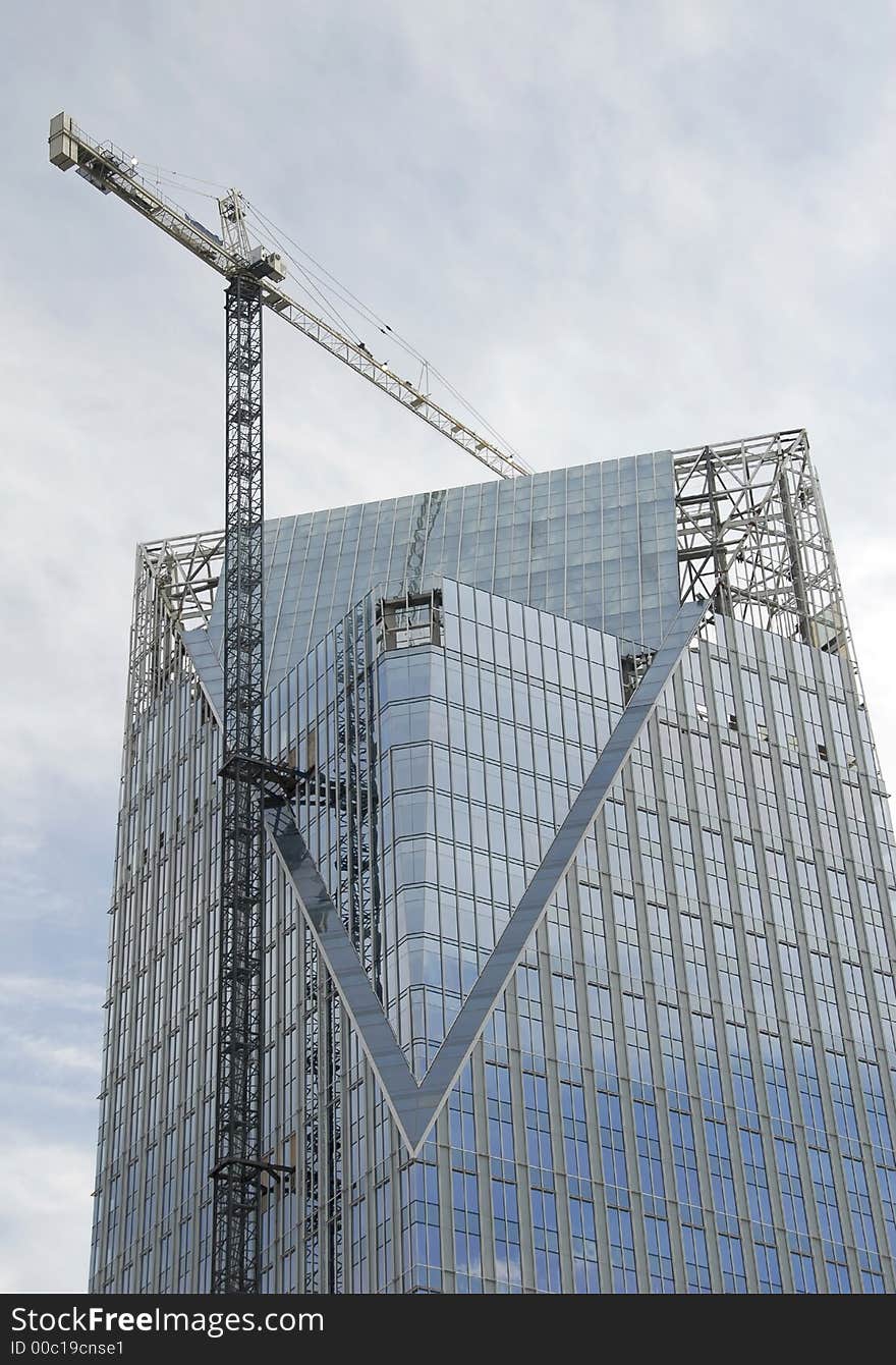 Crane being used on the construction of a new highrise. Crane being used on the construction of a new highrise