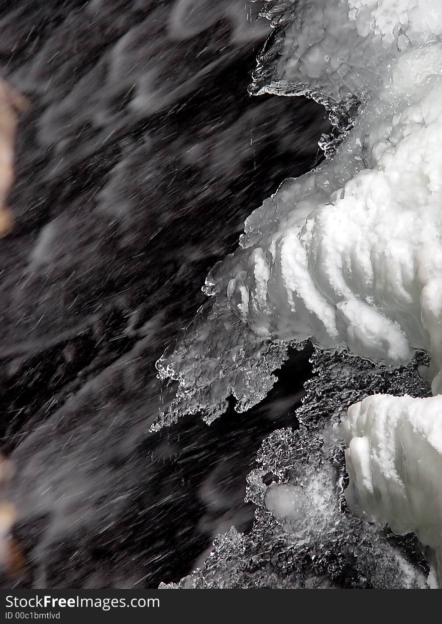 Abstract snow and ice over flowing water