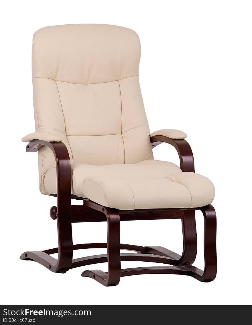 Brown and beige, leather and wood, recliner with matching footstool. Isolated on white. Brown and beige, leather and wood, recliner with matching footstool. Isolated on white.