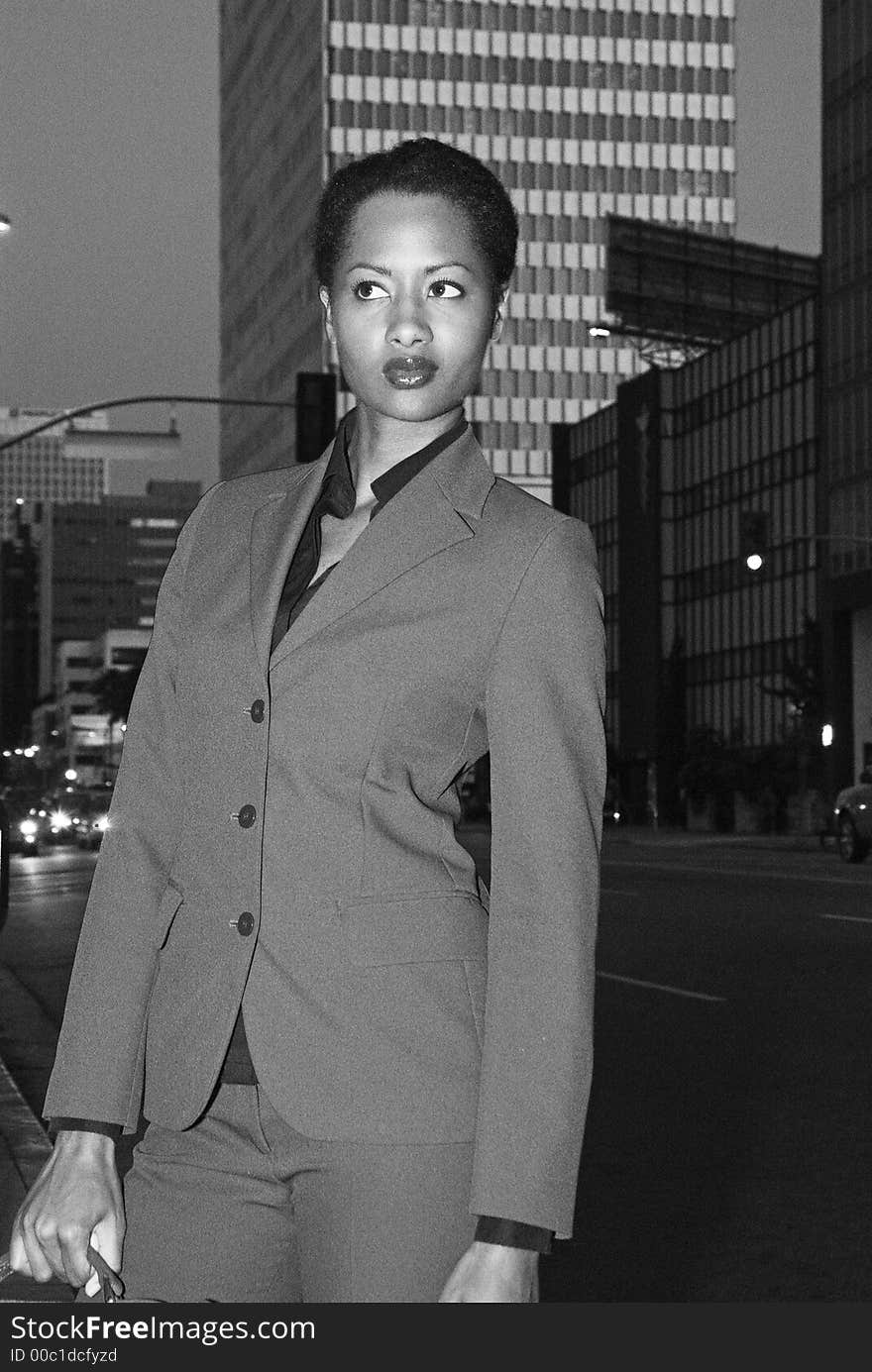 African American business woman returning home from office. African American business woman returning home from office.