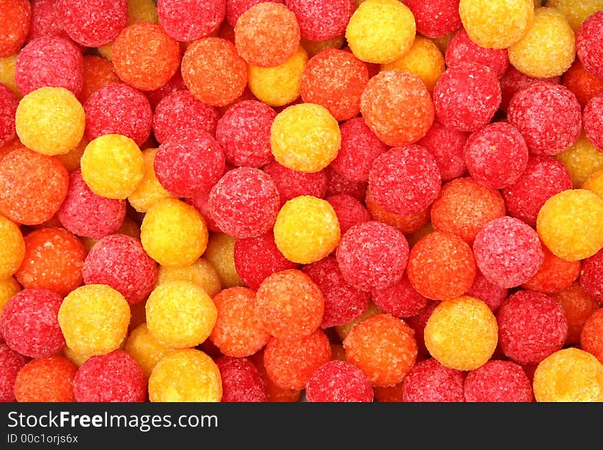 Round sugar sweets of red and yellow color