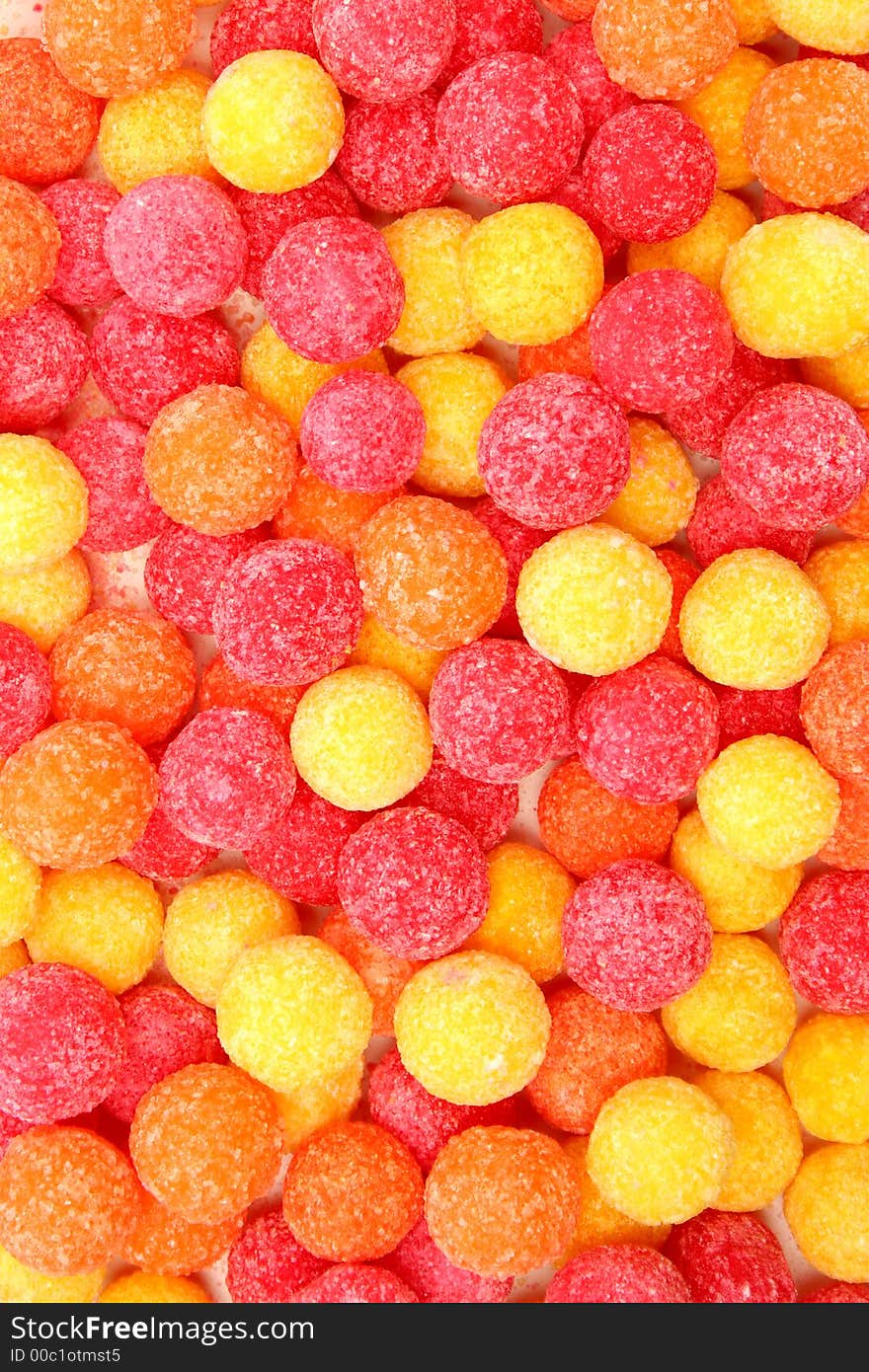 Round sugar sweets of red and yellow color