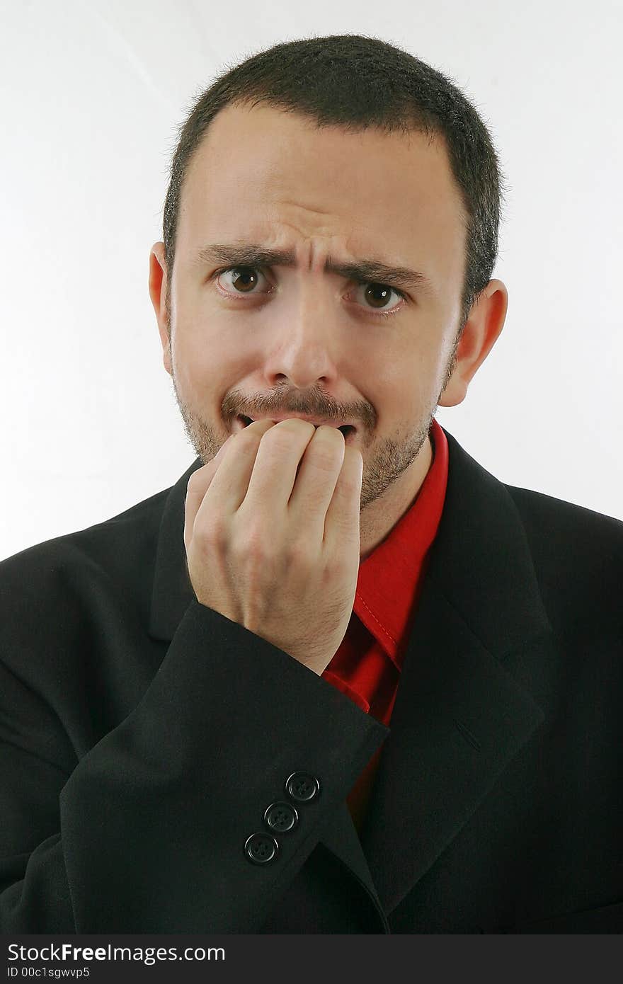 Young man gesticulates, looking at the camera. Young man gesticulates, looking at the camera.