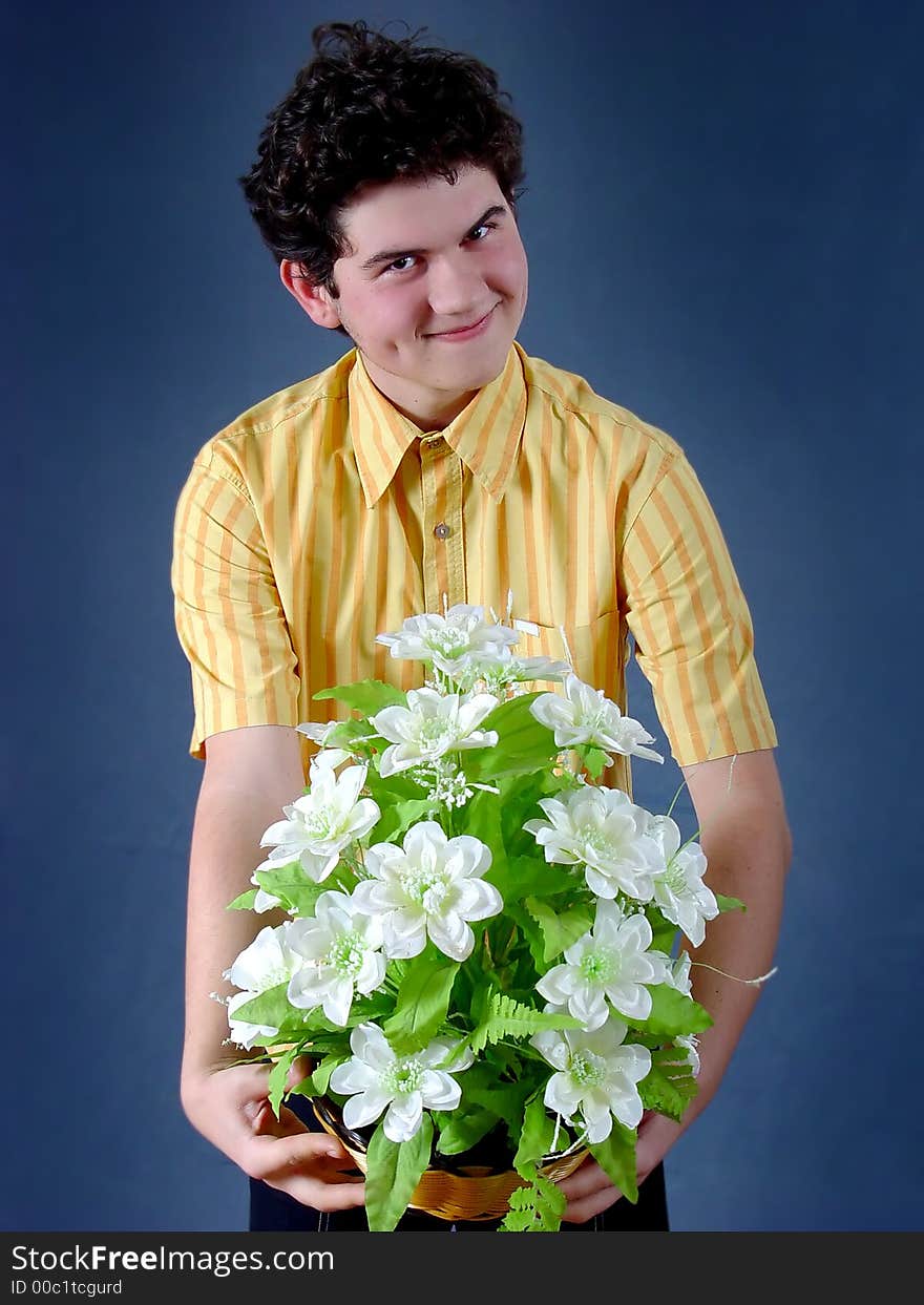 Young boy with white flowers. Young boy with white flowers