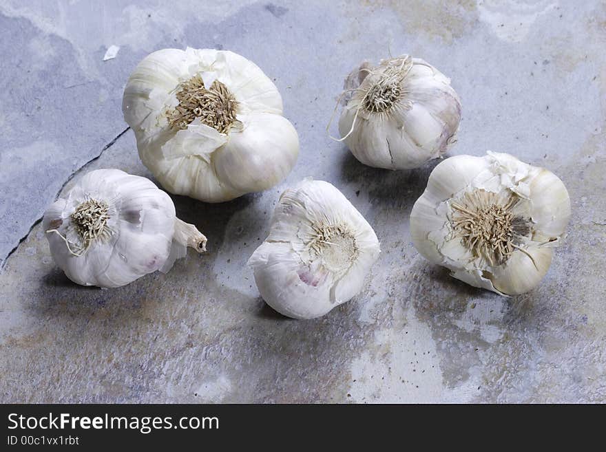 Garlic cloves on a slate background