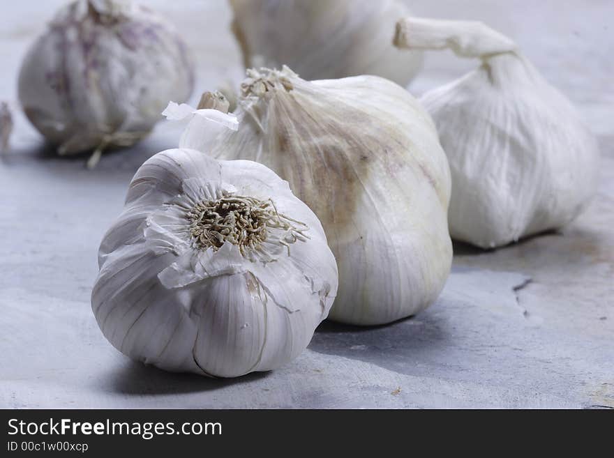 Garlic cloves on a slate background