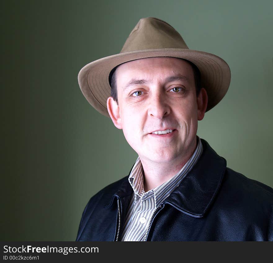 A man wearing a wide rimmed hat. A man wearing a wide rimmed hat.