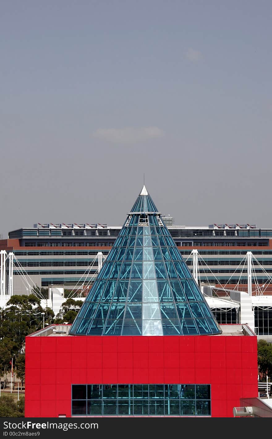 Modern Red Building With Class Cone Roof