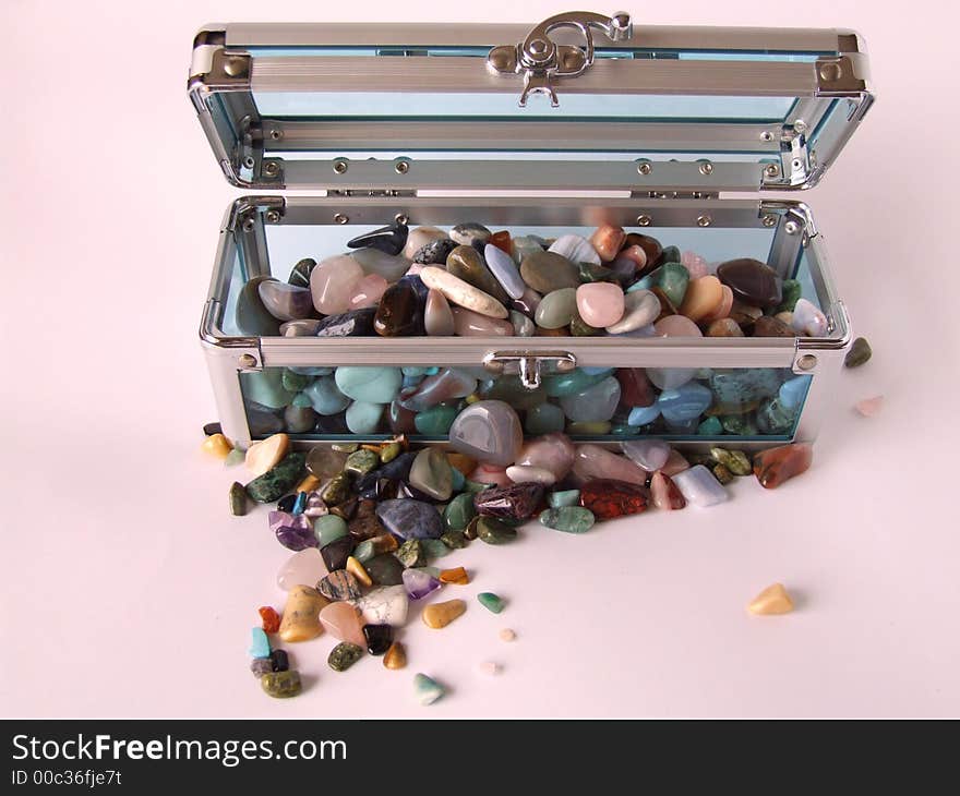 Clear blue treasure chest with gemstones inside and outside. Clear blue treasure chest with gemstones inside and outside