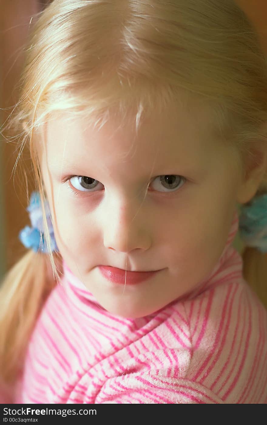 Angelic: A beautiful blue-eyed, blond child dressed in pink. Angelic: A beautiful blue-eyed, blond child dressed in pink