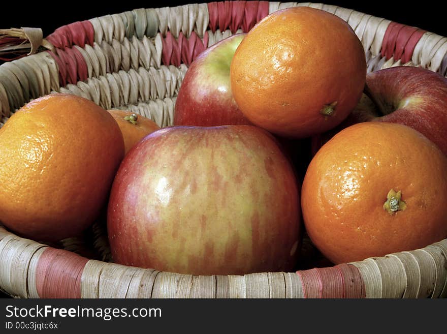 A group of apples and oranges from the local market. A group of apples and oranges from the local market