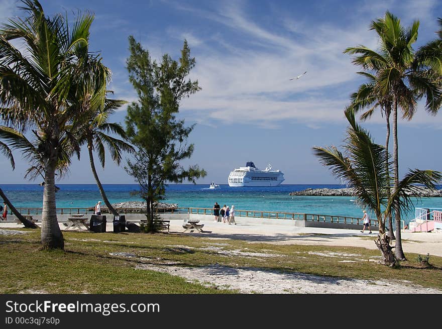 Palm beach with a cruiseship in the background. Palm beach with a cruiseship in the background