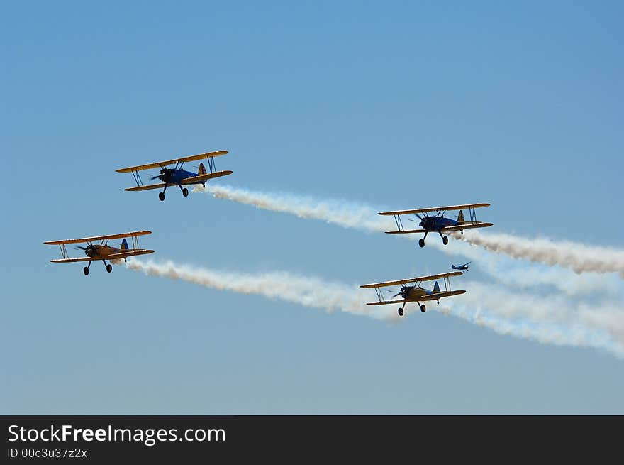 Four Aircraft in formation with smoke on. Four Aircraft in formation with smoke on