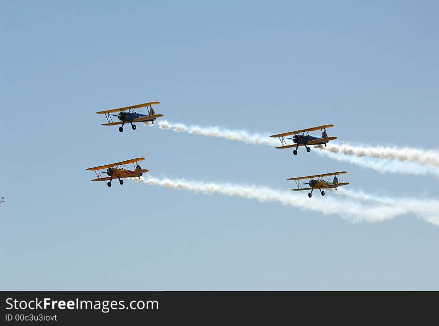 Four Aircraft in formation with smoke on. Four Aircraft in formation with smoke on