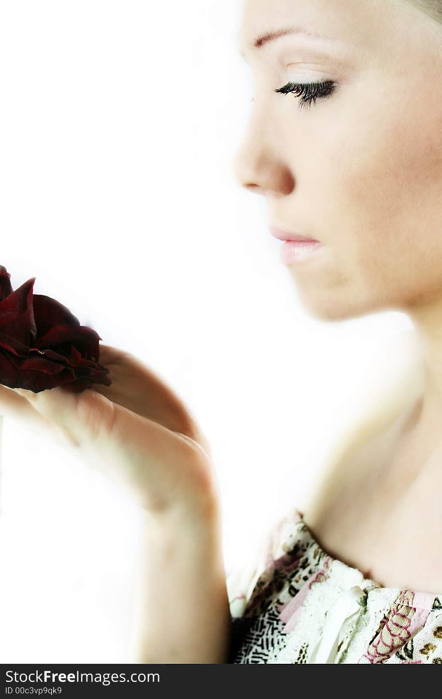 Red rose and the portrait of a fresh and beautiful blond woman. Red rose and the portrait of a fresh and beautiful blond woman