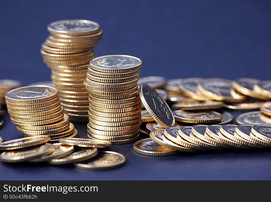 Pile of coins on dark background