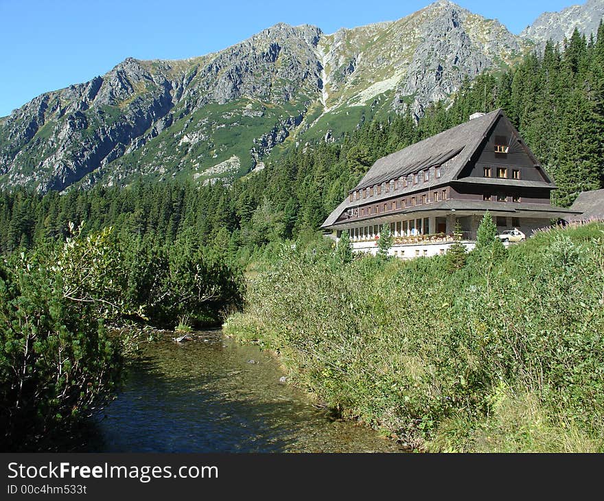 Weekend house near river on mountain.