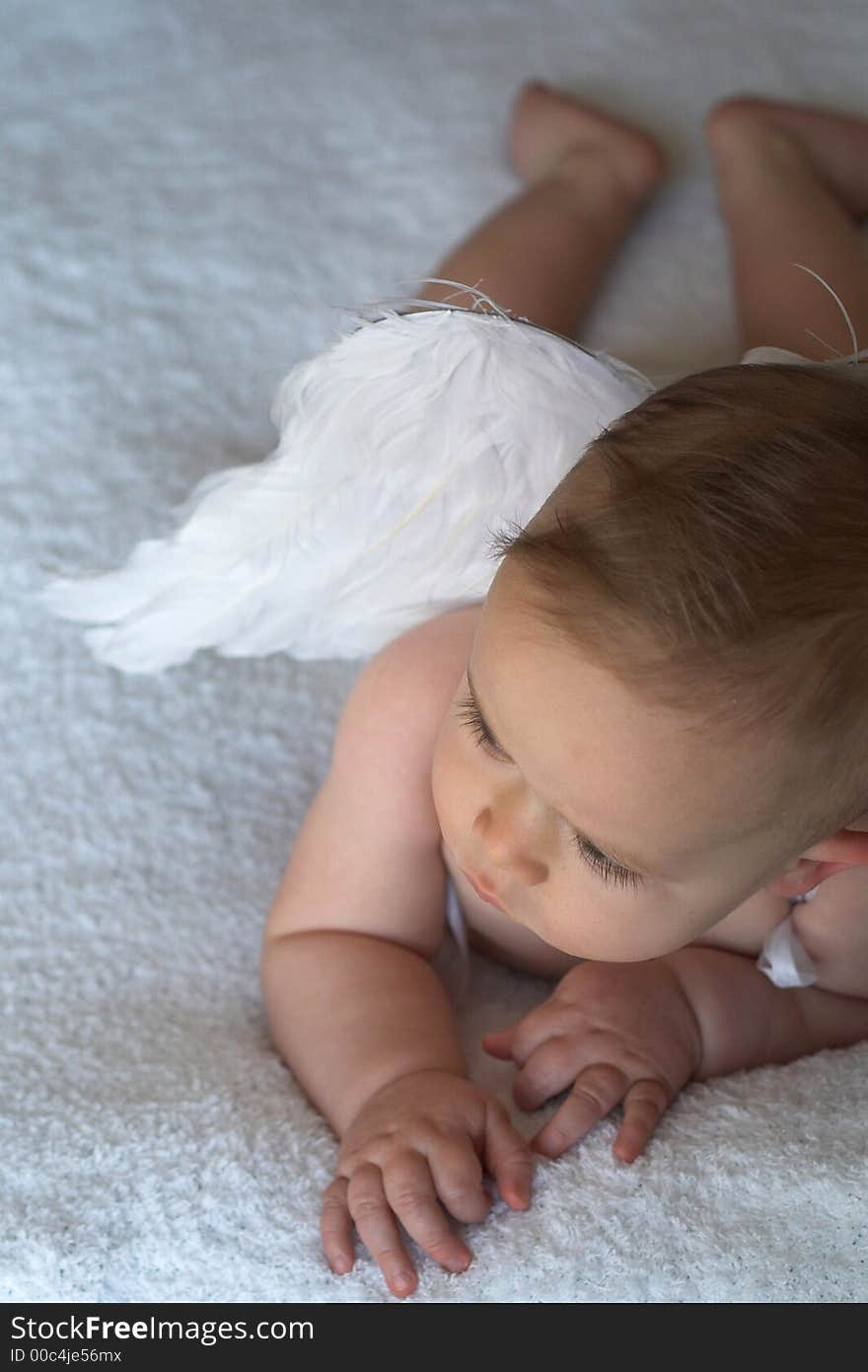 Image of baby wearing angel wings. Image of baby wearing angel wings