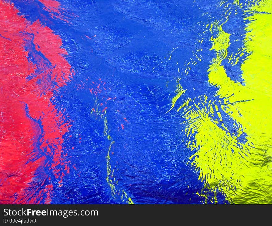 Bright colors in a pool with surface wind patterns