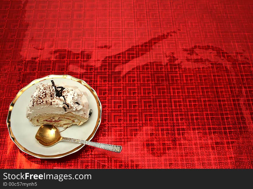 Slice of a pie with the spoon on a red background