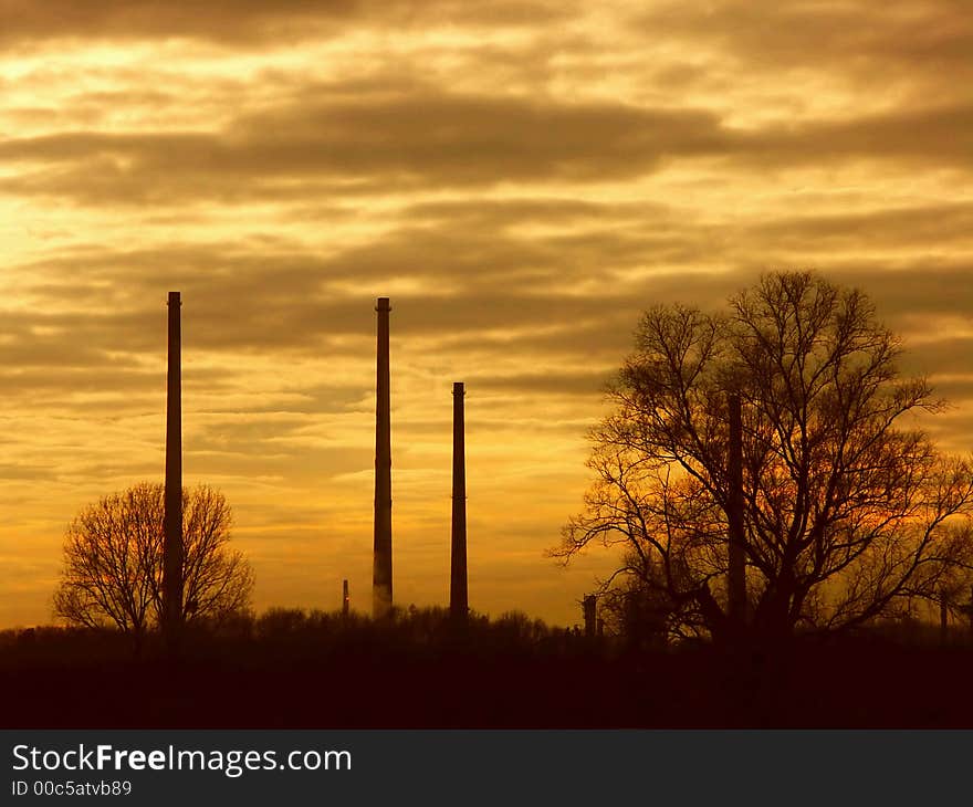 chimneys in sunset