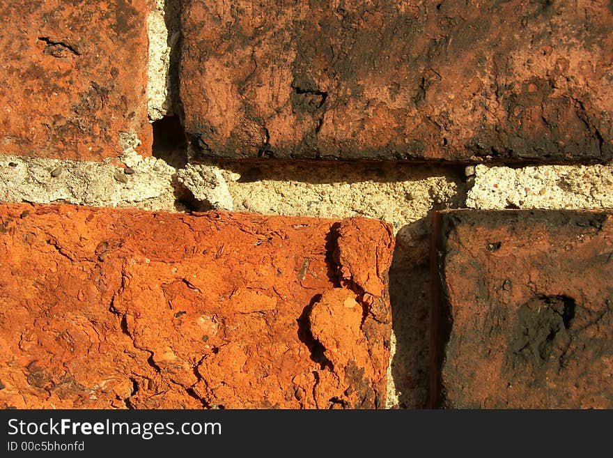 An old brick wall close up background. An old brick wall close up background