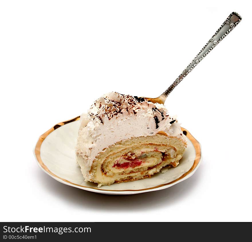 Slice of a pie on plate with the spoon