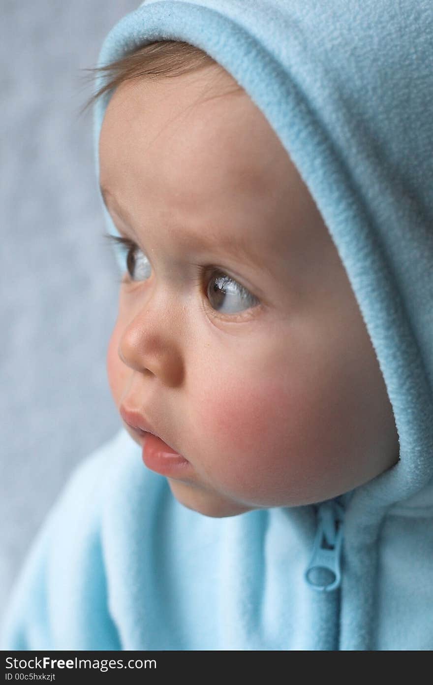 Image of baby wearing a hooded jacket. Image of baby wearing a hooded jacket