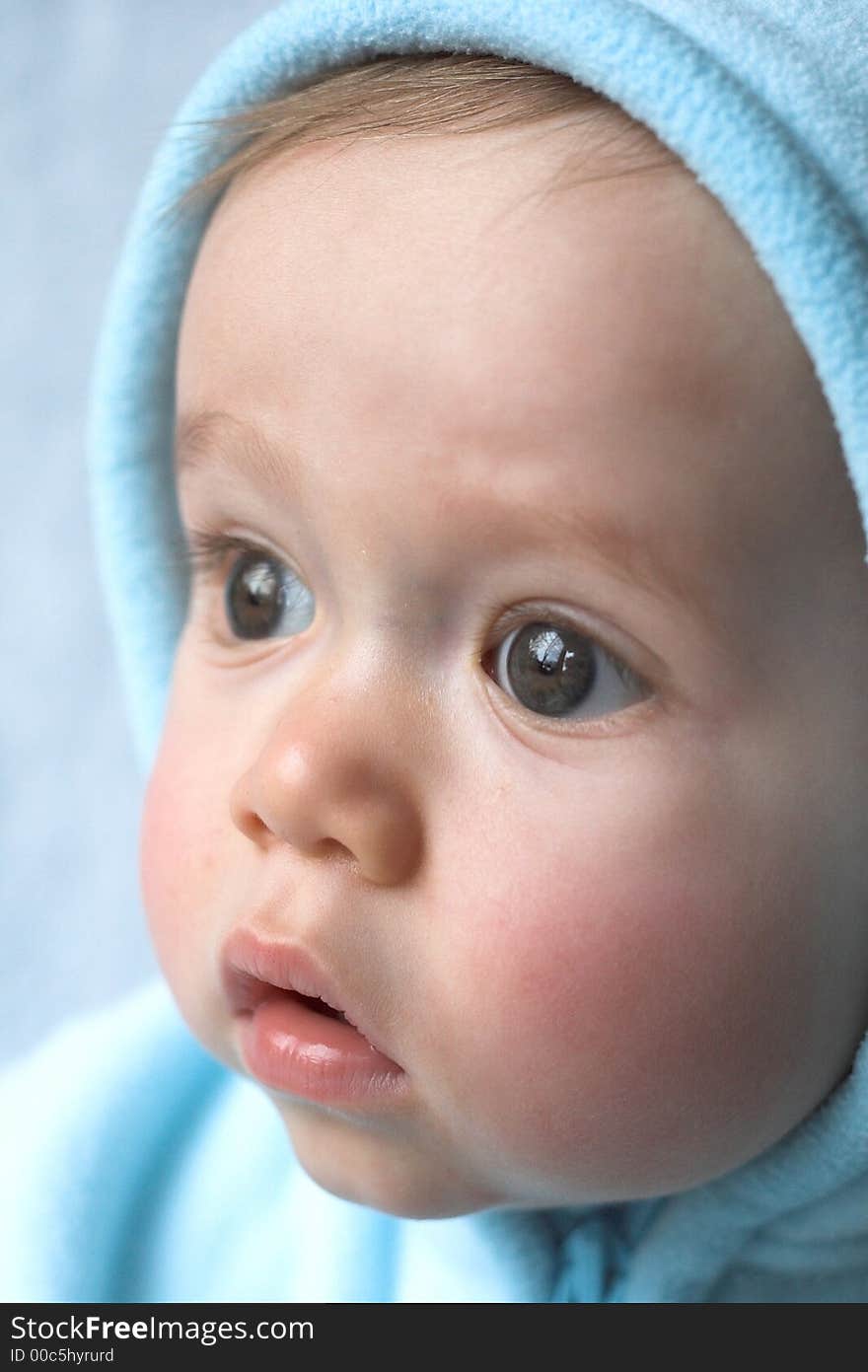 Image of baby wearing a hooded jacket. Image of baby wearing a hooded jacket