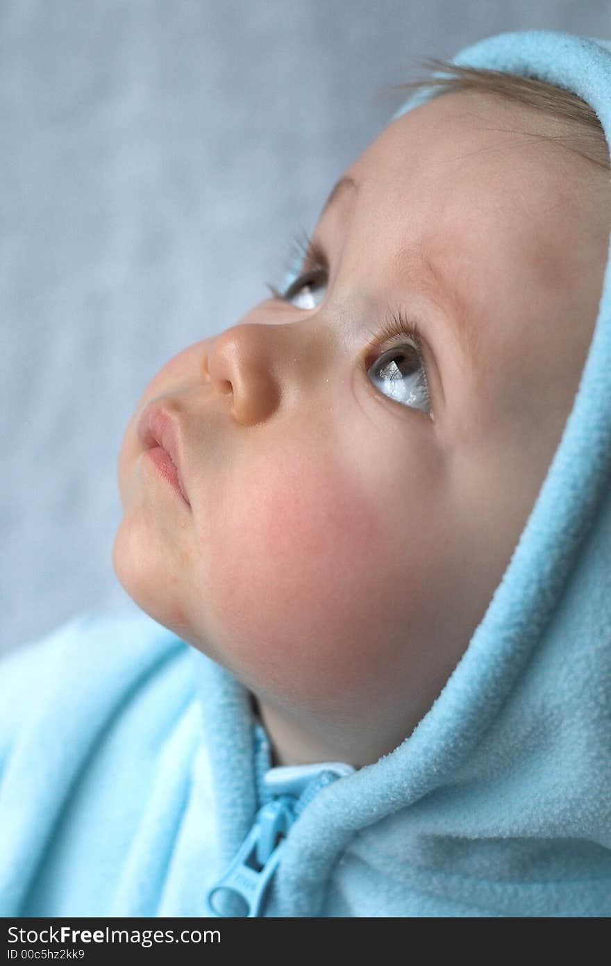 Image of baby wearing a hooded jacket. Image of baby wearing a hooded jacket