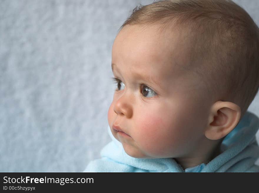 Image of baby wearing a hooded jacket. Image of baby wearing a hooded jacket