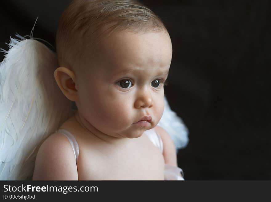 Image of baby wearing angel wings. Image of baby wearing angel wings