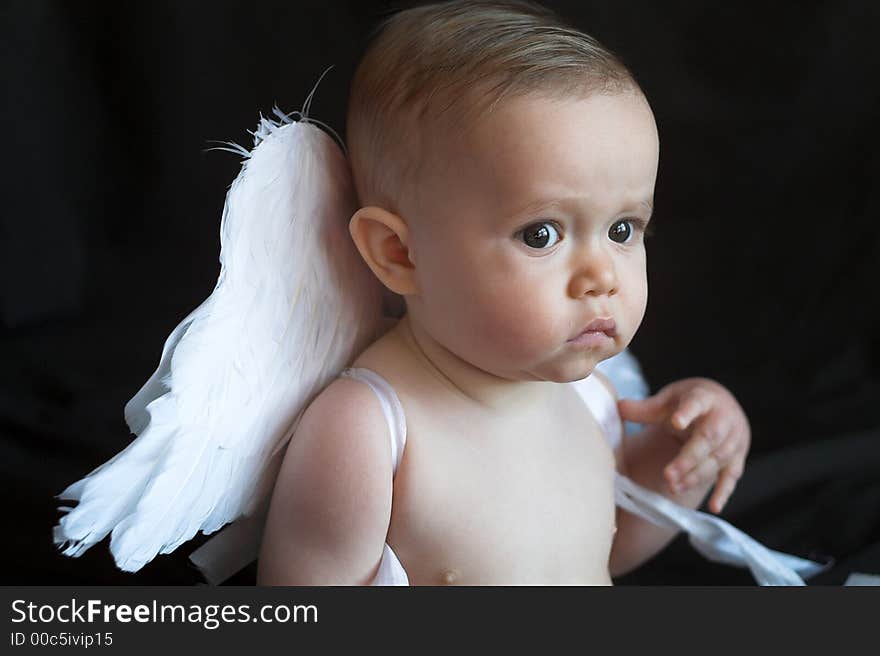 Image of baby wearing angel wings. Image of baby wearing angel wings