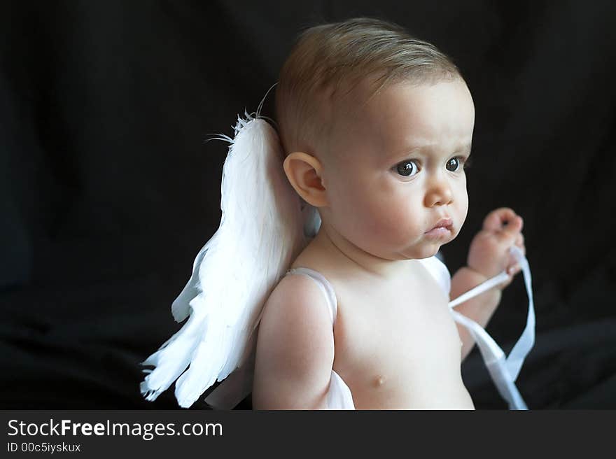 Image of baby wearing angel wings. Image of baby wearing angel wings