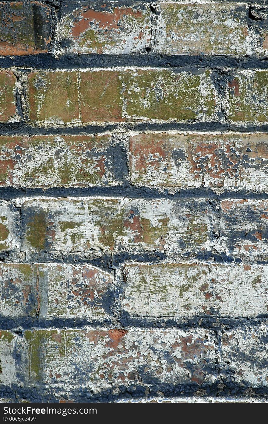 Detail of grunge brick wall with chipped paint