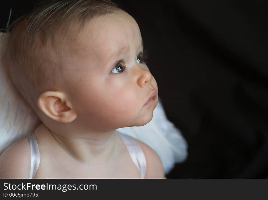 Image of baby wearing angel wings. Image of baby wearing angel wings