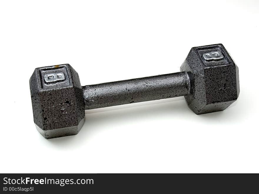 A single eight pound hexagonal dumbbell. A single eight pound hexagonal dumbbell